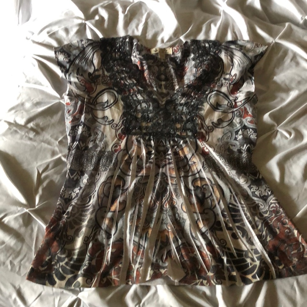 Unity World wear multi-print short sleeve top.